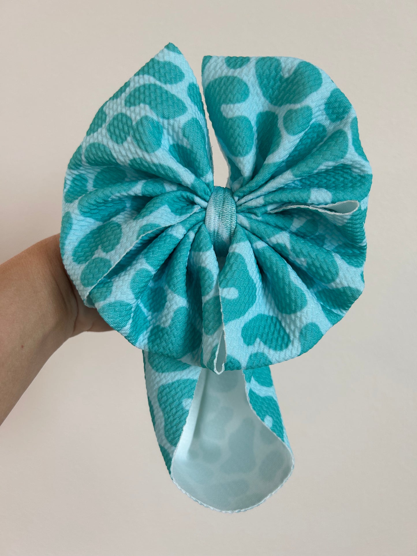 BABY MESSY BOW -TURQUOISE CHEETAH